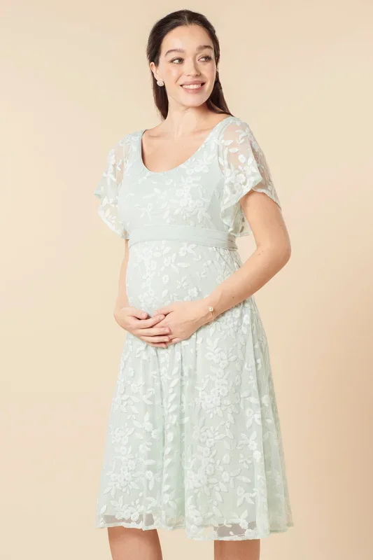 Festive maternity dress made of lace with embroidery, mint