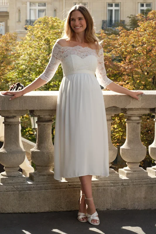 Off-shoulder maternity wedding dress made of lace