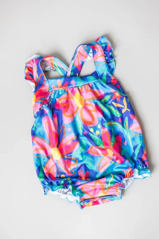 SALE Springing Around Ruffle Cross Back Romper